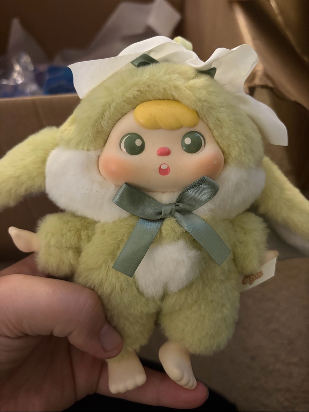 Plush Bunny Doll with Green Fur and Ribbon